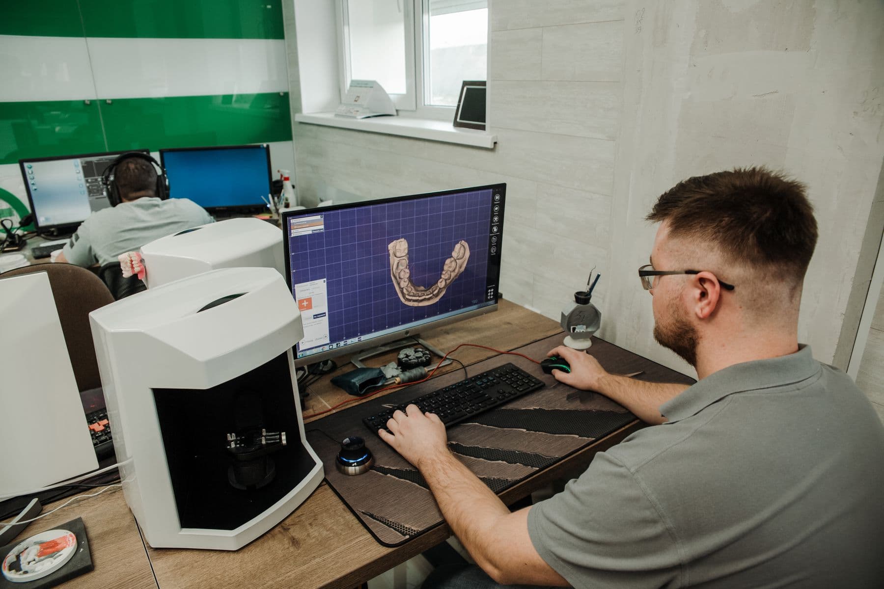 Dental technician designing a restoration in Exocad CAD/CAM software